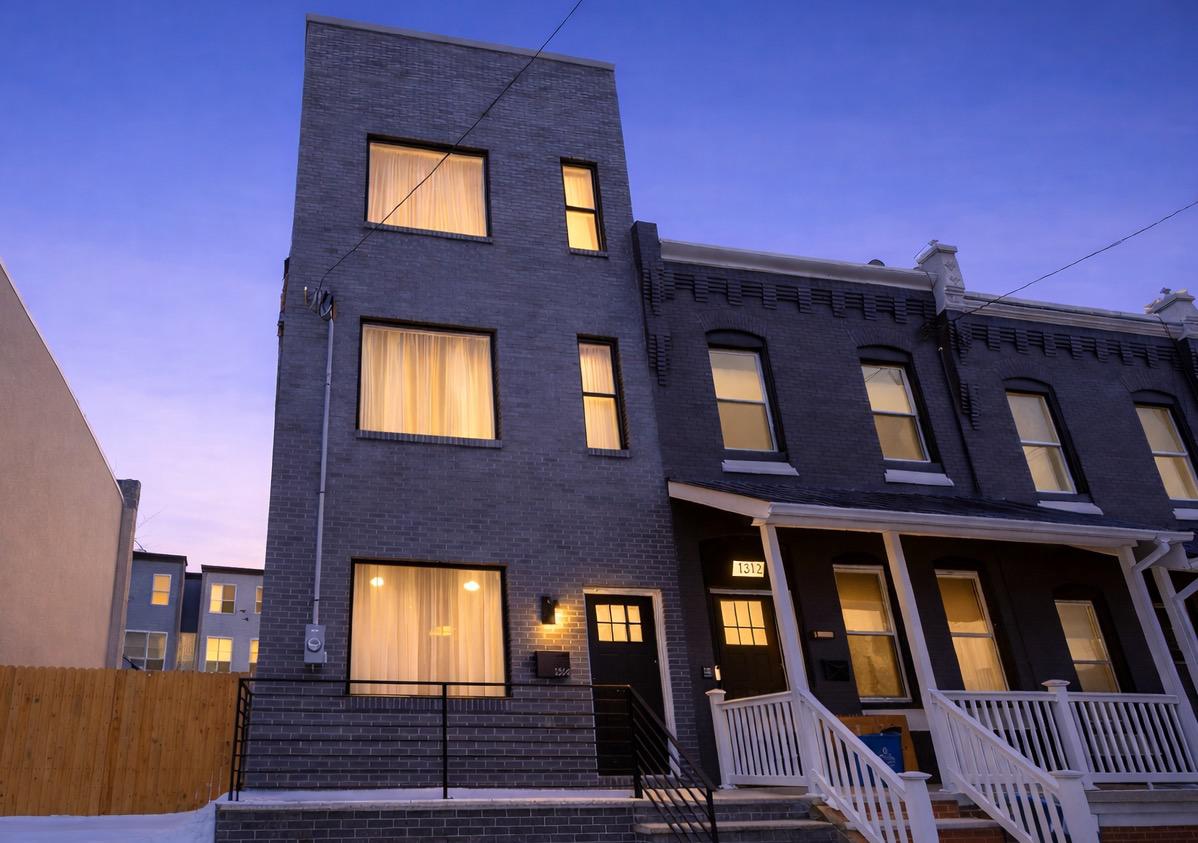 1314 South 46th Street Philadelphia, PA 19143 - Photo 55 of 56 a front view of residential houses with stairs