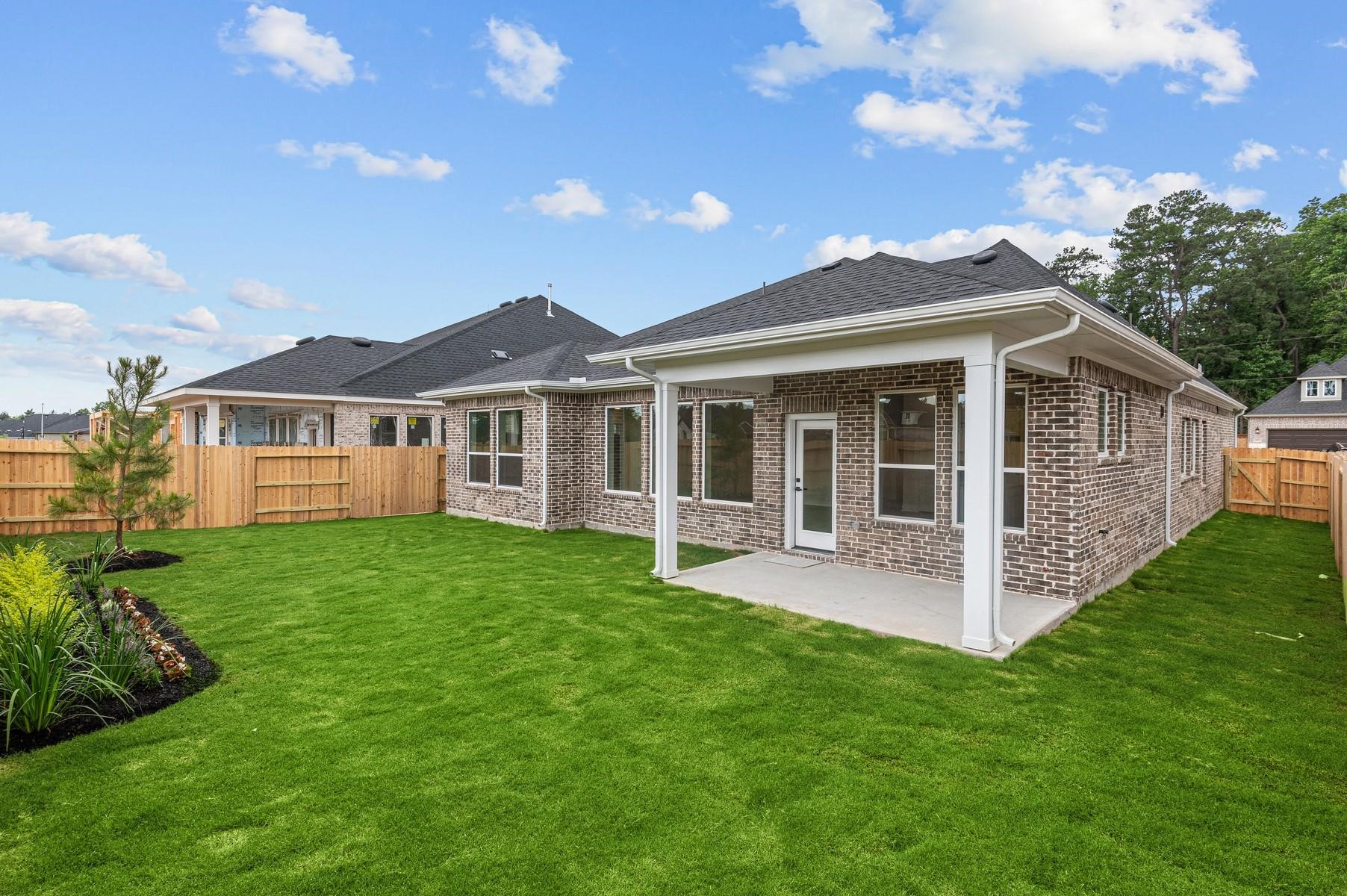 29626 Cedar Elm Way Tomball, TX 77375 - Photo 12 of 12 a view of a house with a yard and porch