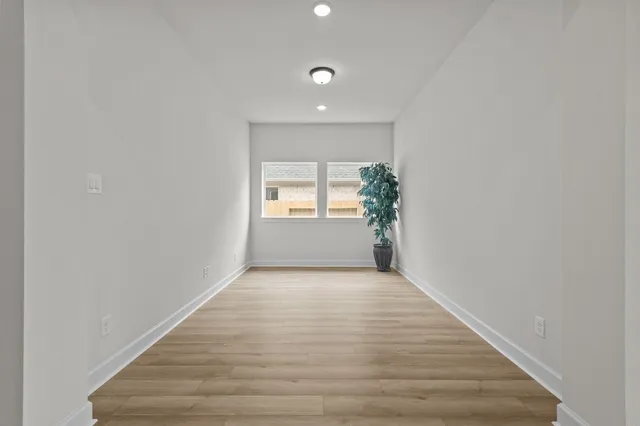 a view of an empty room and window