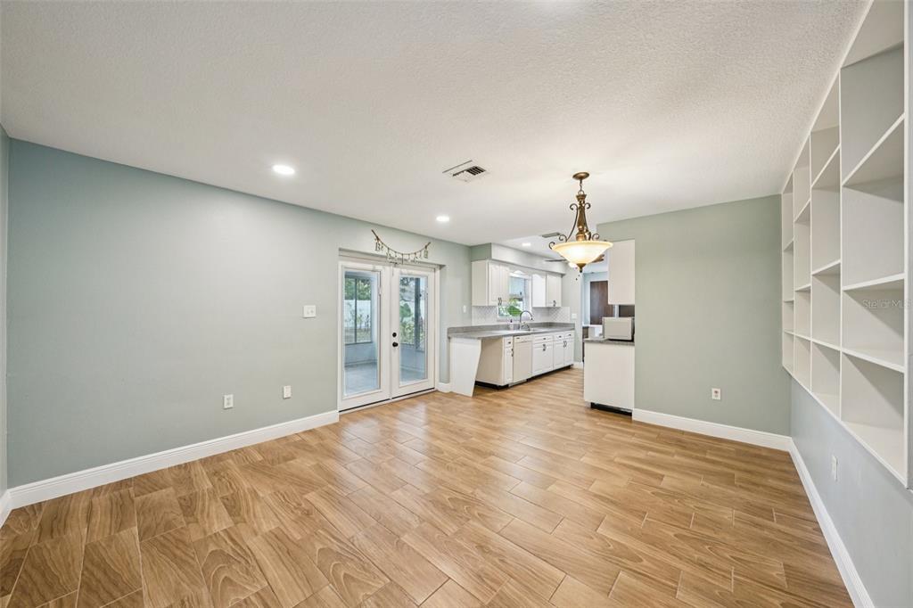 1118 Carlton Road Tarpon Springs, FL 34689 - Photo 15 of 62 a view of an empty room with window and cabinet