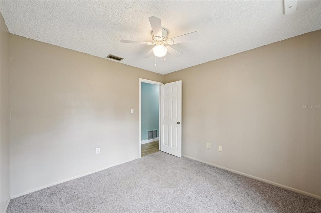 1118 Carlton Road Tarpon Springs, FL 34689 - Photo 31 of 62 a view of an empty room and chandelier fan