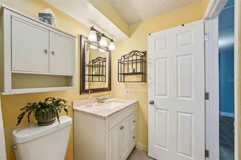 1118 Carlton Road Tarpon Springs, FL 34689 - Photo 33 of 62 a bathroom with a sink a toilet and shower
