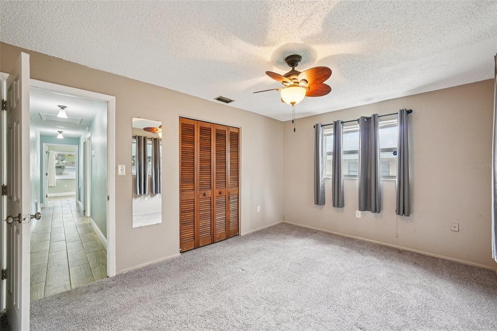 1118 Carlton Road Tarpon Springs, FL 34689 - Photo 35 of 62 wooden floor in an empty room with a window