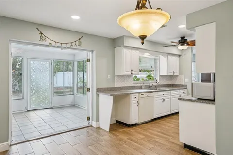 a view of a yard with potted plants