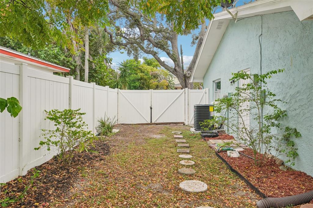 1118 Carlton Road Tarpon Springs, FL 34689 - Photo 44 of 62 a view of a yard with potted plants
