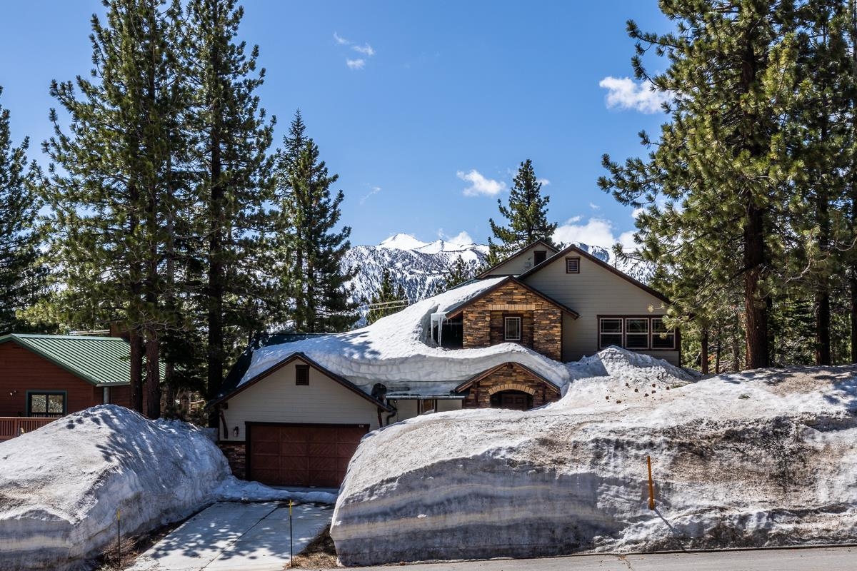103 Holiday Way Mammoth Lakes, CA 93546 - Photo 15 of 40 a front view of a house with a yard