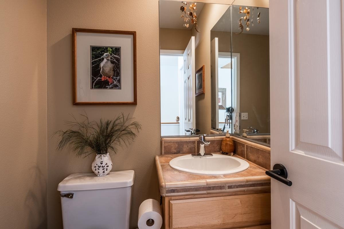 103 Holiday Way Mammoth Lakes, CA 93546 - Photo 17 of 40 a bathroom with a sink toilet and mirror