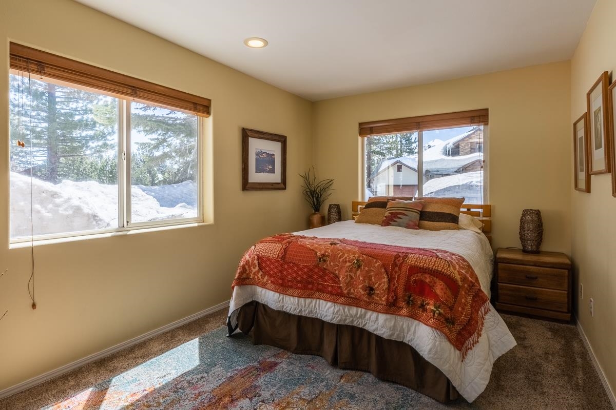 103 Holiday Way Mammoth Lakes, CA 93546 - Photo 24 of 40 a bedroom with a bed and window