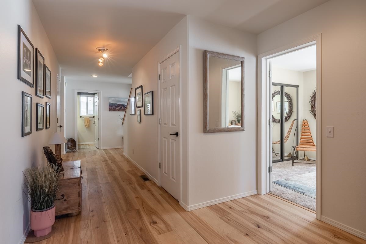 103 Holiday Way Mammoth Lakes, CA 93546 - Photo 4 of 40 a view of hallway with livingroom and wooden floor