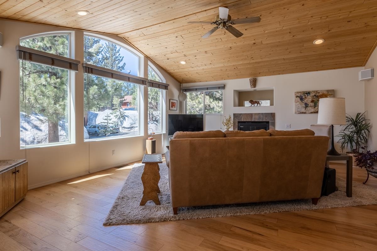 103 Holiday Way Mammoth Lakes, CA 93546 - Photo 5 of 40 a living room with furniture and a fireplace