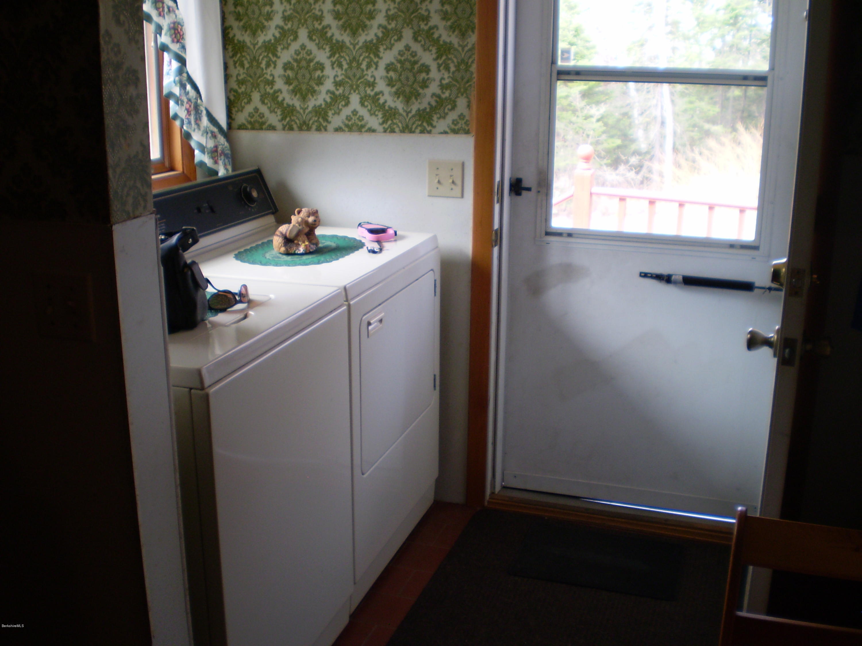 45 N Road Peru, MA 01235 - Photo 41 of 68 a storage room with wooden floor washer and dryer
