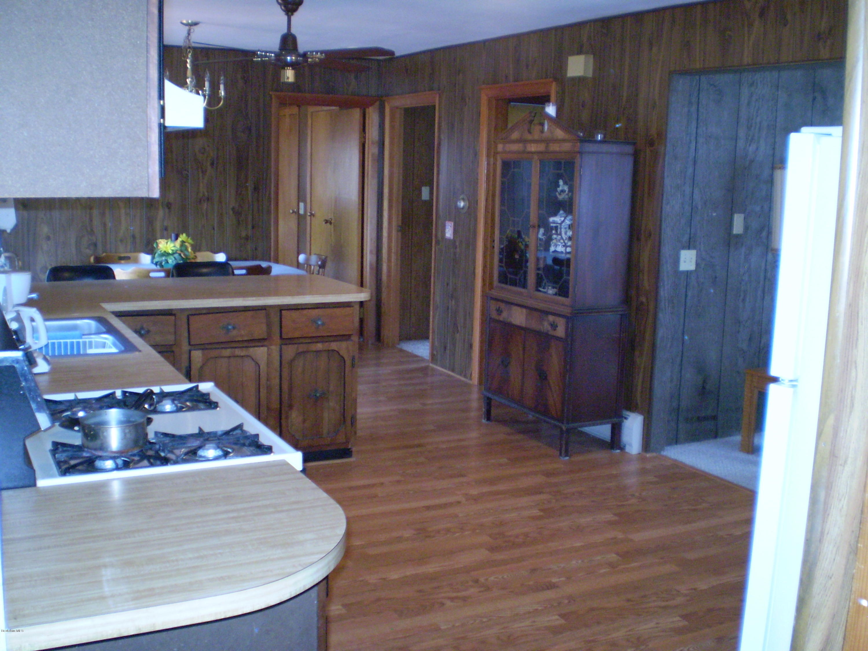 45 N Road Peru, MA 01235 - Photo 44 of 68 a kitchen with stainless steel appliances granite countertop a sink and a refrigerator