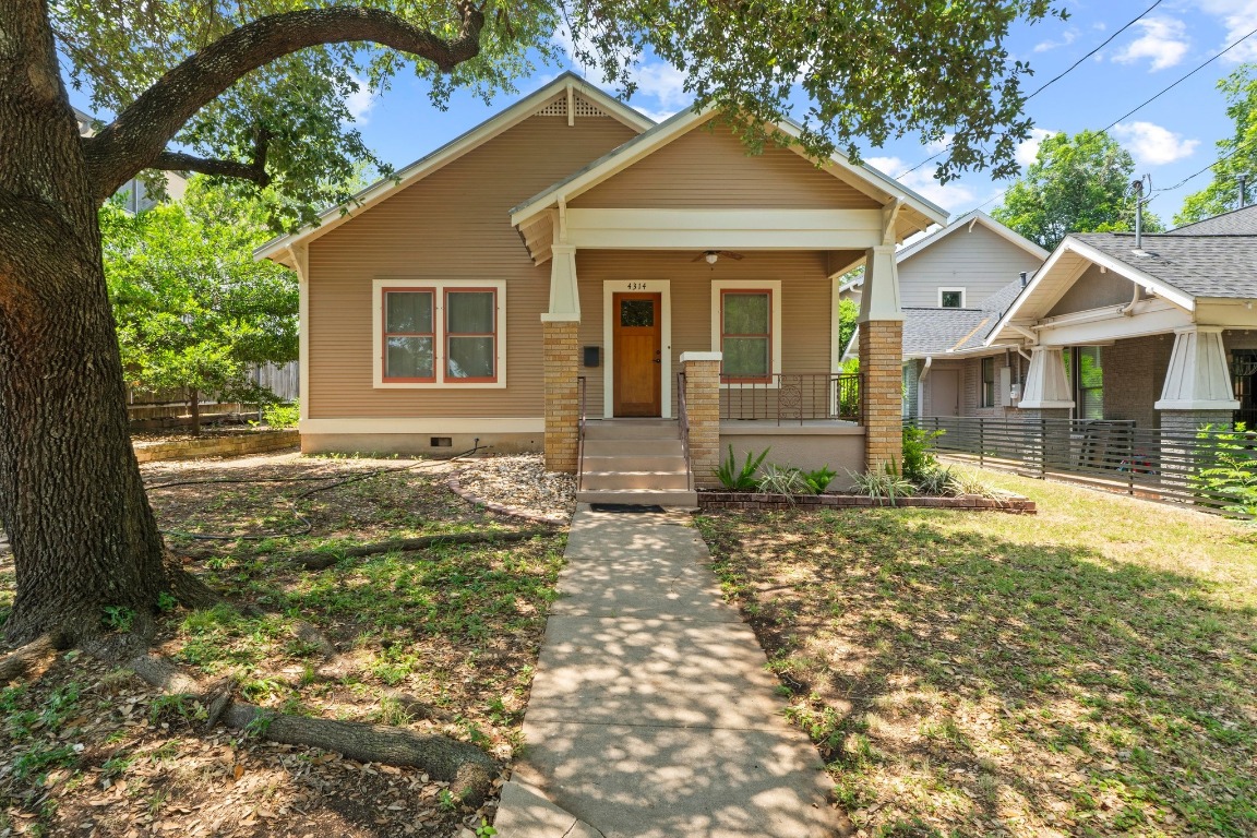 4314 Duval Street Austin, TX 78751 - Photo 1 of 33 a front view of a house with a yard