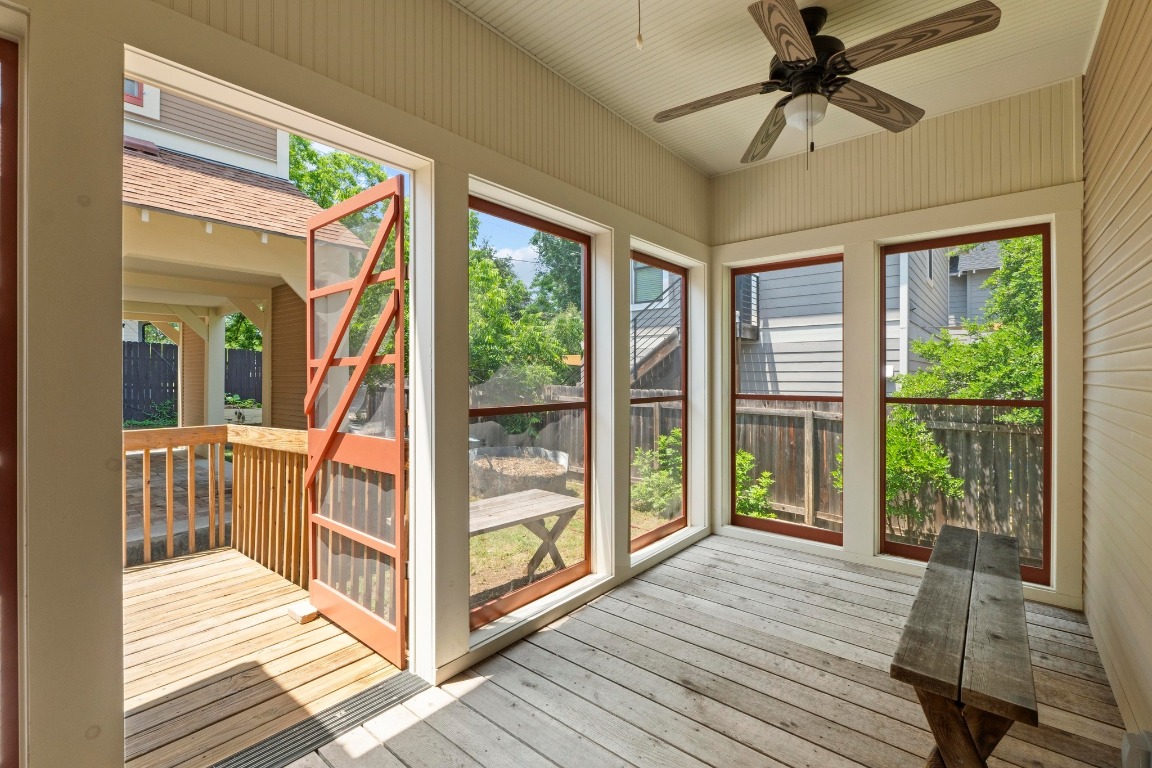 4314 Duval Street Austin, TX 78751 - Photo 23 of 33 a view of a balcony with wooden floor and iron stairs