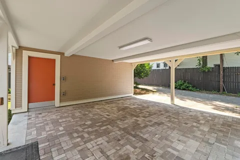 a view of a house with porch and wooden floor