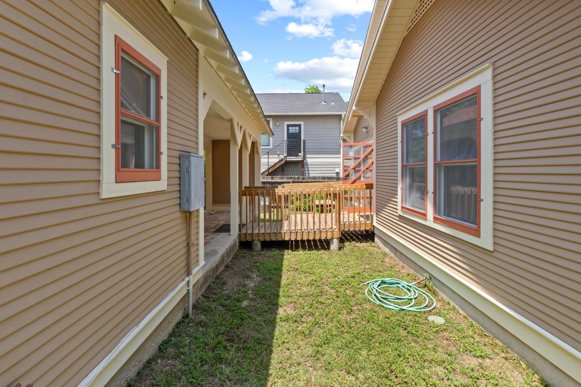 4314 Duval Street Austin, TX 78751 - Photo 27 of 33 a view of a house with a wooden deck and a yard