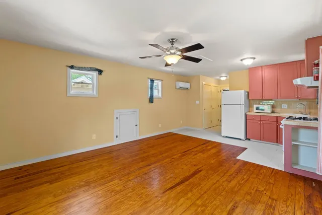 a kitchen with a refrigerator stove and sink