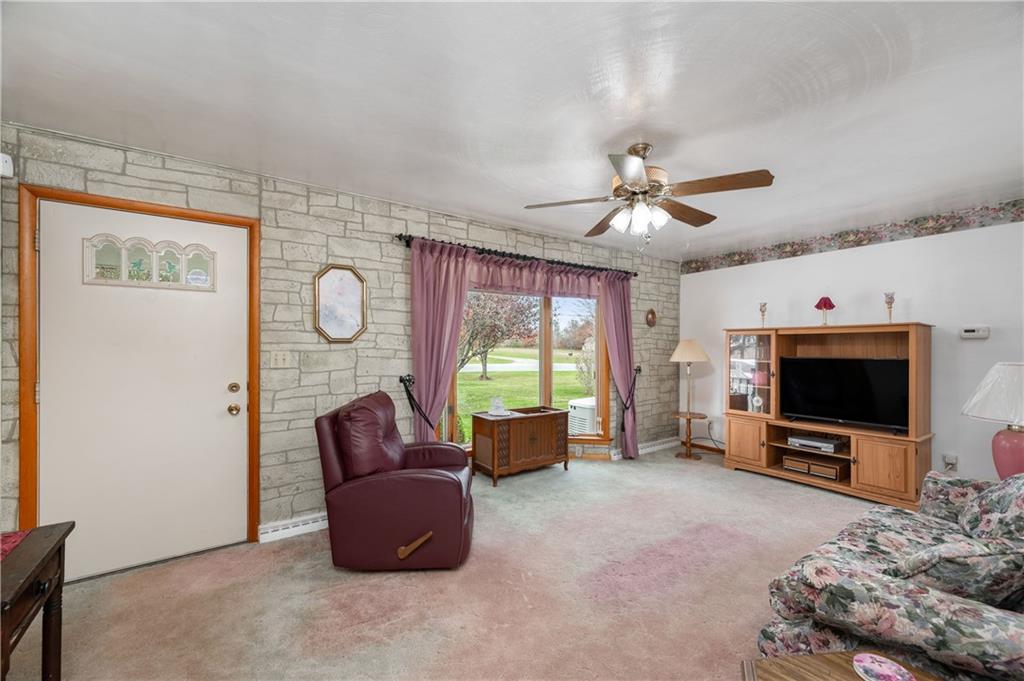 668 Greenfield Road Mercer, PA 16137 - Photo 15 of 49 a living room with furniture and a flat screen tv