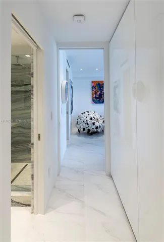 a bedroom with a large bed and a couch