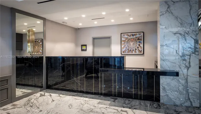 a living room with furniture gym equipment and a rug