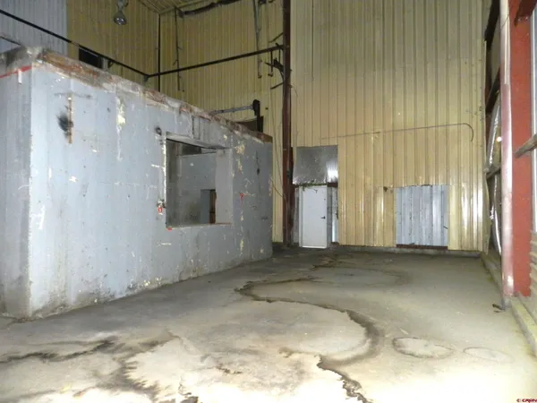 a kitchen with refrigerator and cabinets
