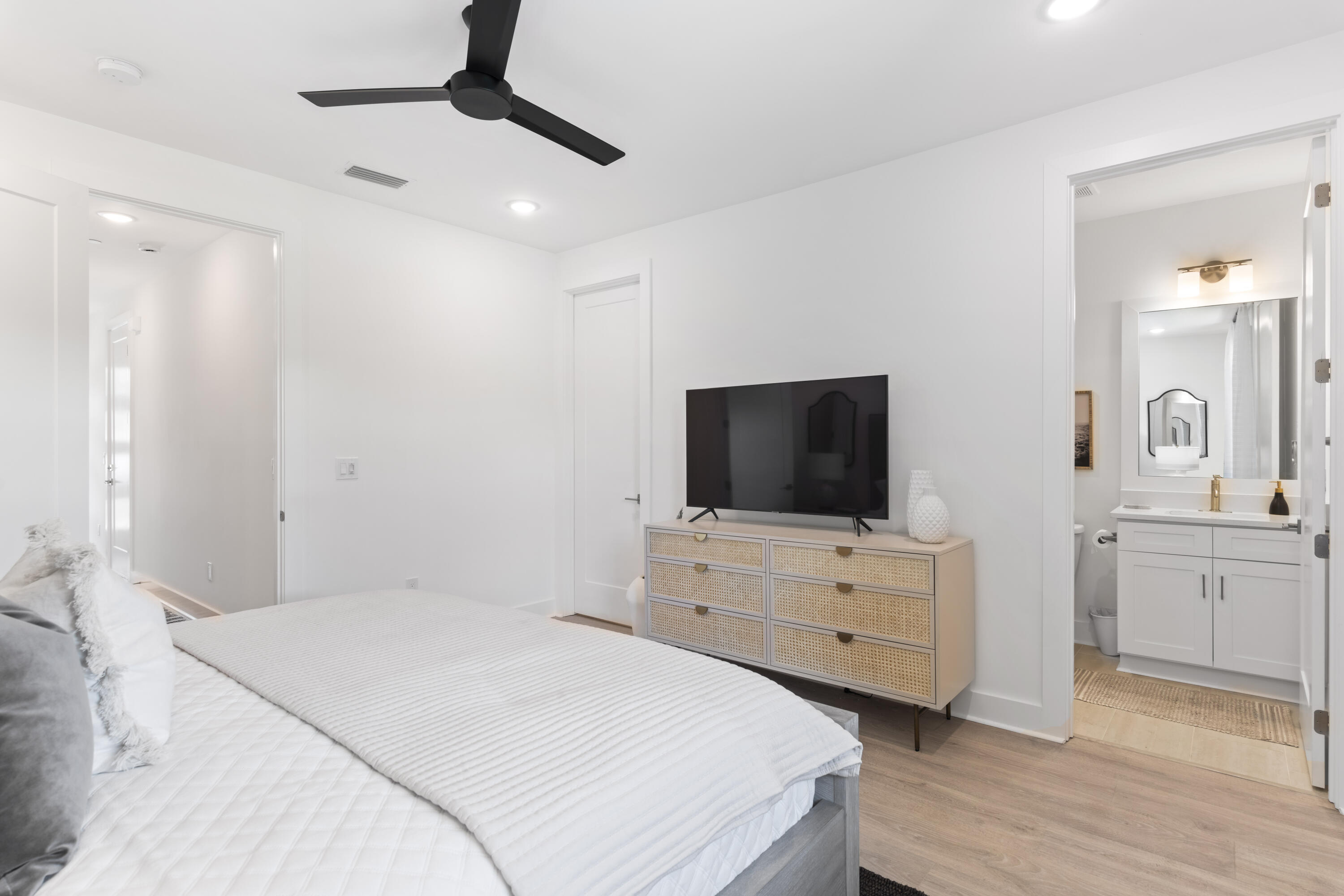 29 Blue Eden Loop, Unit LOT 24 Santa Rosa Beach, FL 32459 - Photo 21 of 32 a bedroom with a bed and a flat screen tv