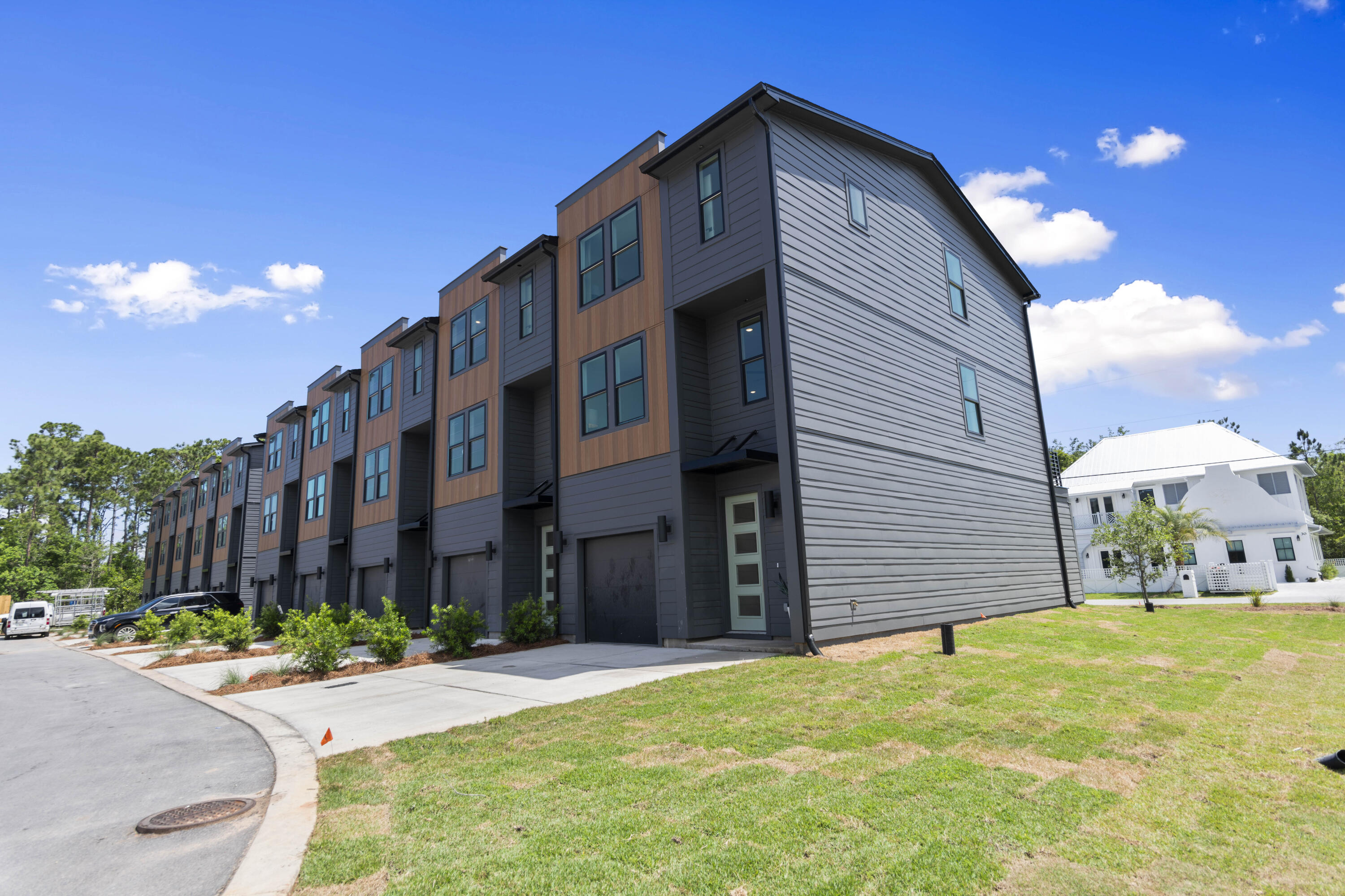 29 Blue Eden Loop, Unit LOT 24 Santa Rosa Beach, FL 32459 - Photo 4 of 32 a front view of a house with a yard