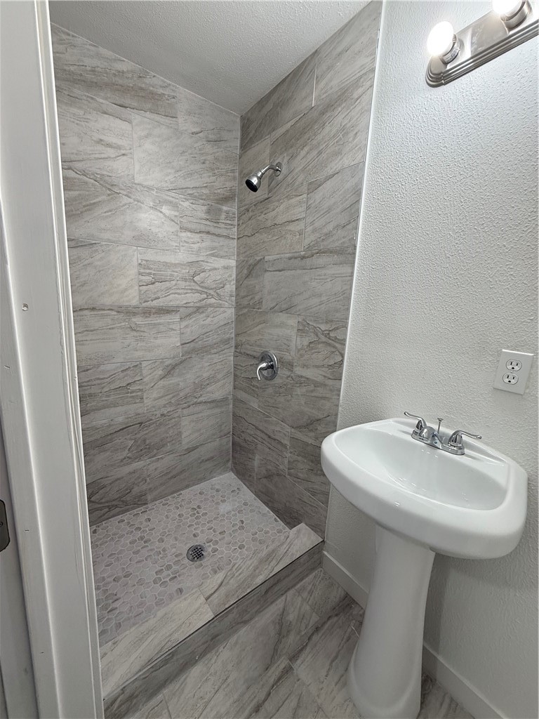 3001 Ruth Street Corpus Christi, TX 78405 - Photo 21 of 27 a bathroom with a sink a toilet and shower