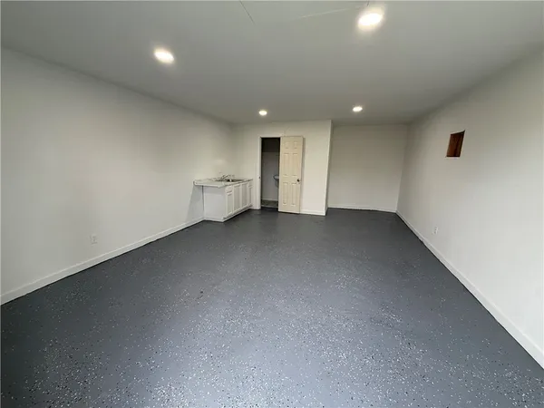 a bathroom with a sink toilet and a mirror