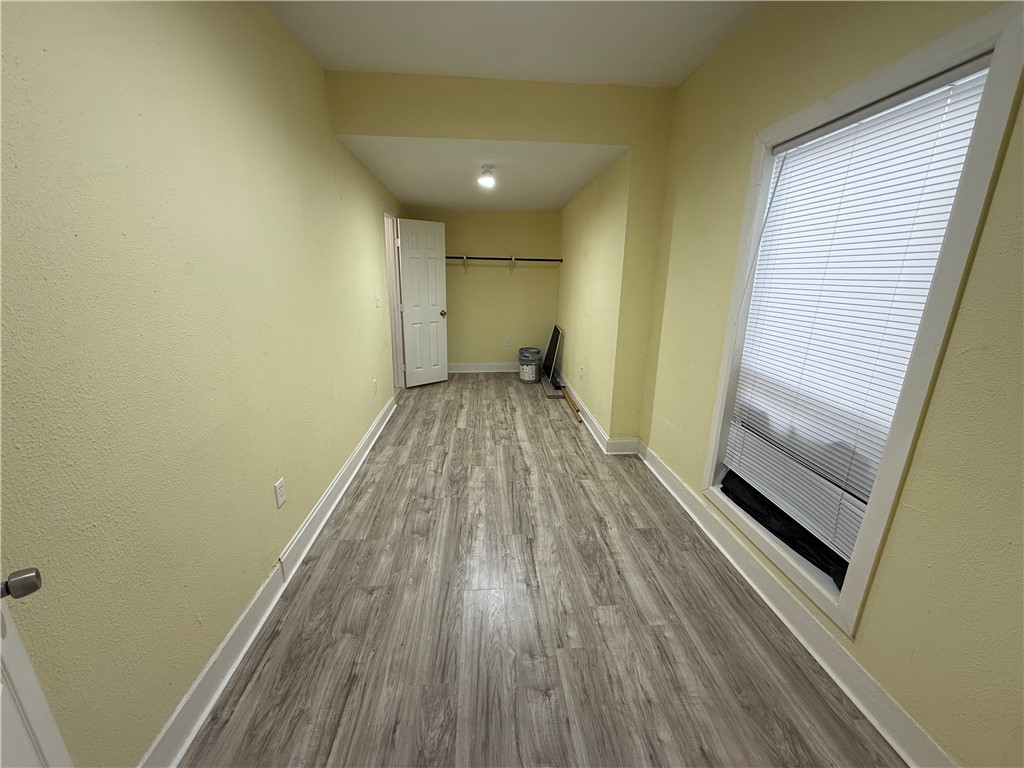 3001 Ruth Street Corpus Christi, TX 78405 - Photo 6 of 27 a view of a room with wooden floor and a window
