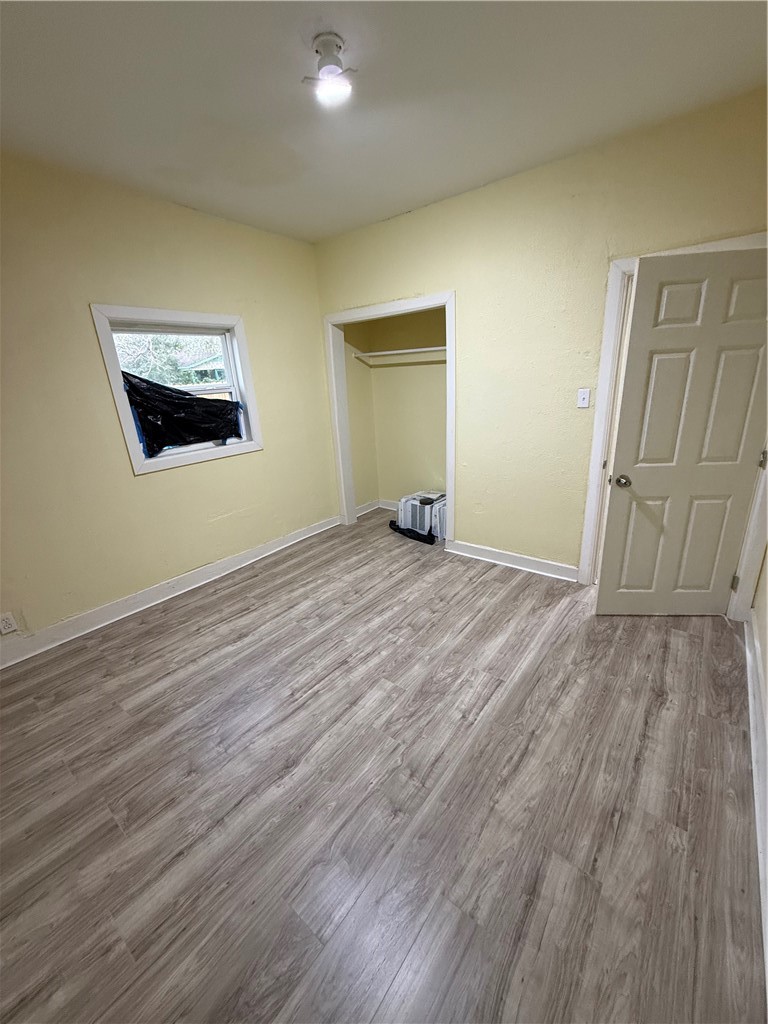 3001 Ruth Street Corpus Christi, TX 78405 - Photo 10 of 27 an empty room with wooden floor and windows