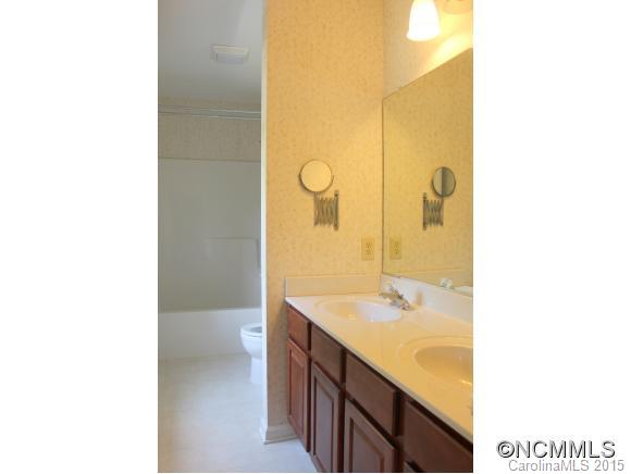 223 General Griffith Circle Rutherfordton, NC 28139 - Photo 17 of 24 a bathroom with a sink a toilet and shower