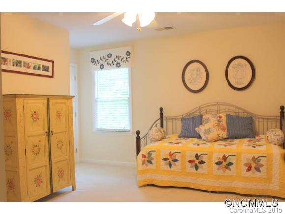 223 General Griffith Circle Rutherfordton, NC 28139 - Photo 18 of 24 a bedroom with a bed and wooden floor