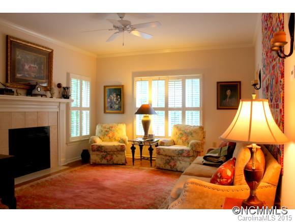223 General Griffith Circle Rutherfordton, NC 28139 - Photo 5 of 24 a living room with furniture a fireplace and a flat screen tv