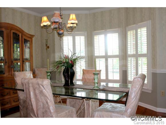 223 General Griffith Circle Rutherfordton, NC 28139 - Photo 7 of 24 a view of a dining room with furniture a chandelier and wooden floor