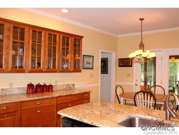 223 General Griffith Circle Rutherfordton, NC 28139 - Photo 8 of 24 a kitchen with stainless steel appliances granite countertop a stove a sink and a granite counter tops