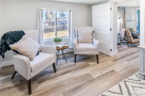 a living room with furniture and a window
