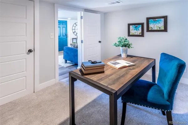 a view of a workspace with furniture