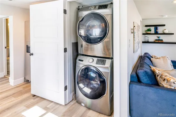 a view of a hallway with washer and dryer