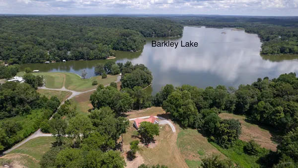 an aerial view of a house with a yard and a garden
