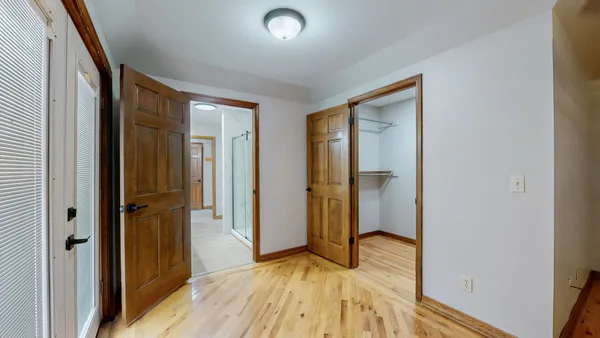 a view of an empty room with closet