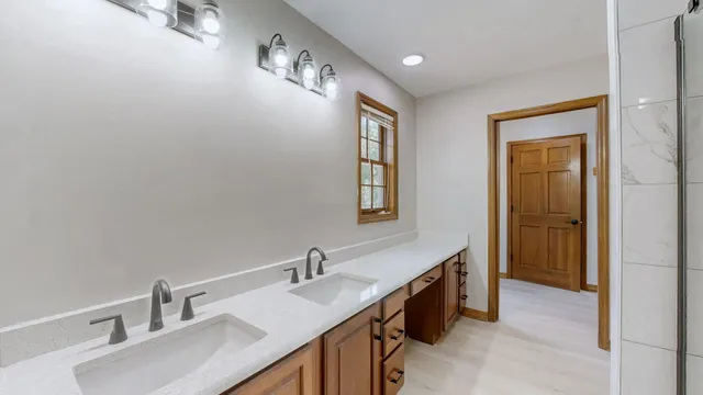 a bathroom with a sink double vanity and a mirror
