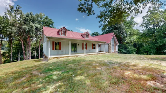 a house with trees in the background