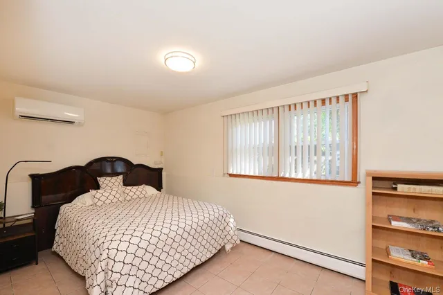a bedroom with a large bed and a large window