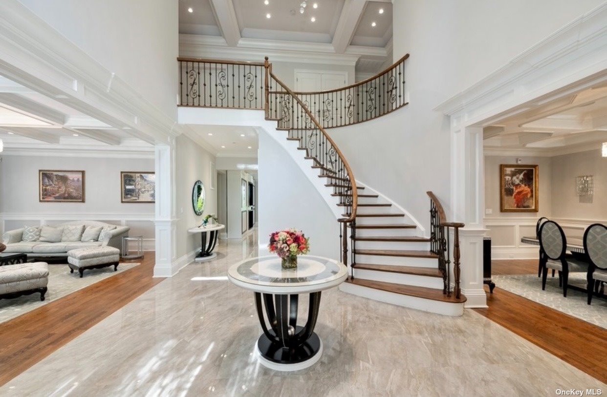 24 West Terrace Road Great Neck, NY 11023 - Photo 1 of 1 a living room with furniture and a chandelier