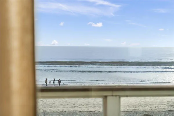 a view of ocean from a sink