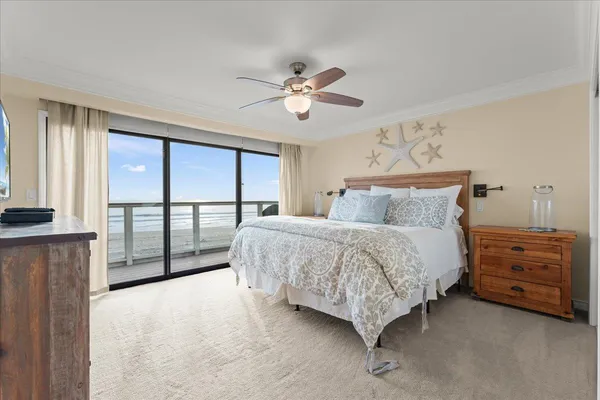 a spacious bedroom with a bed and a large window