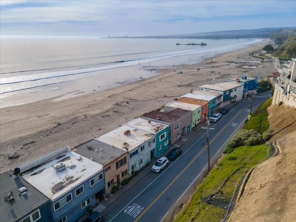 a view of a balcony with wooden floor