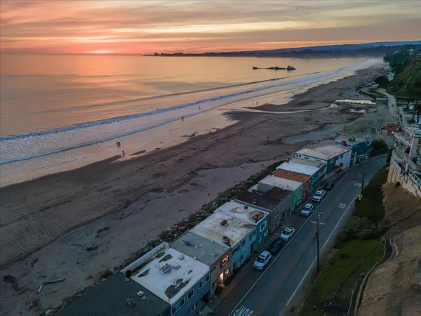 a view of an buildings with car parked