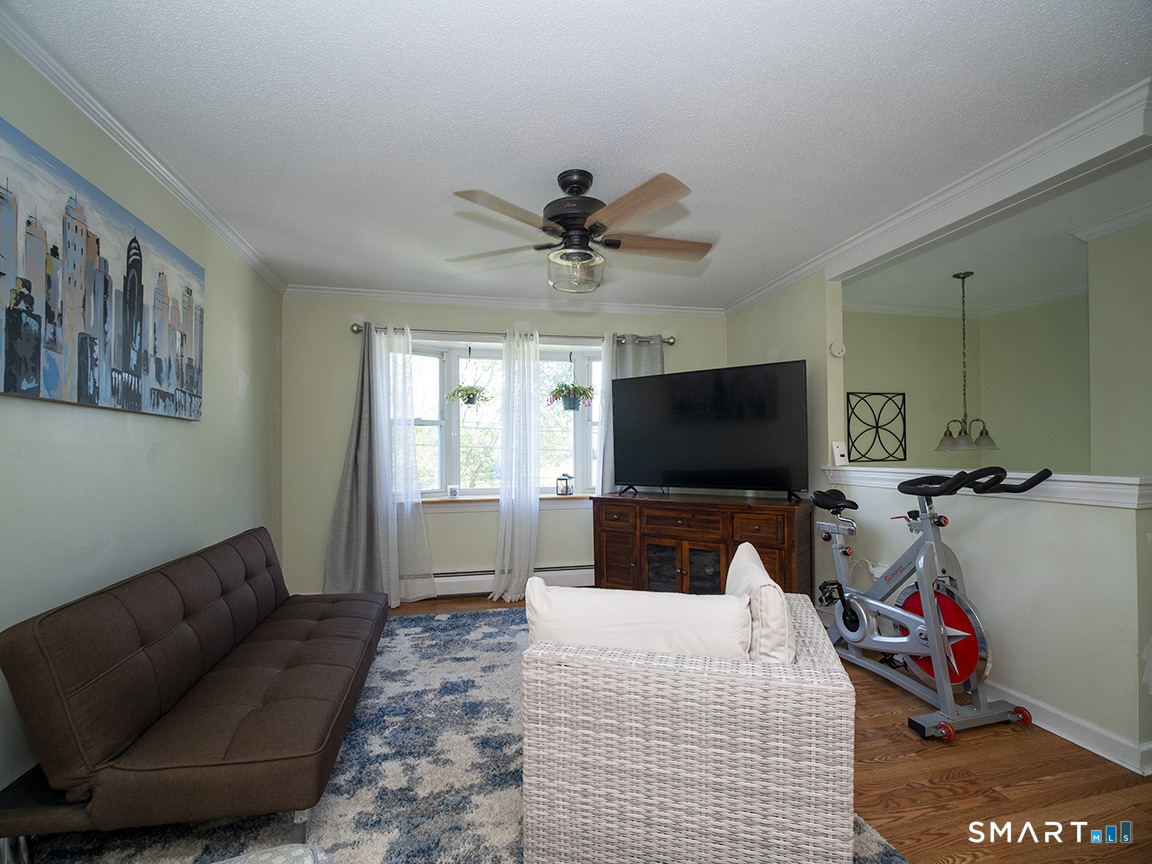 82 Wilcox Road Middletown, CT 06457 - Photo 11 of 27 a bedroom with furniture and a flat screen tv